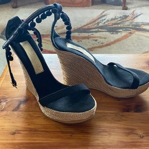 Hollywould black with silver and gold wedges with Pom Pom trim.Size 6